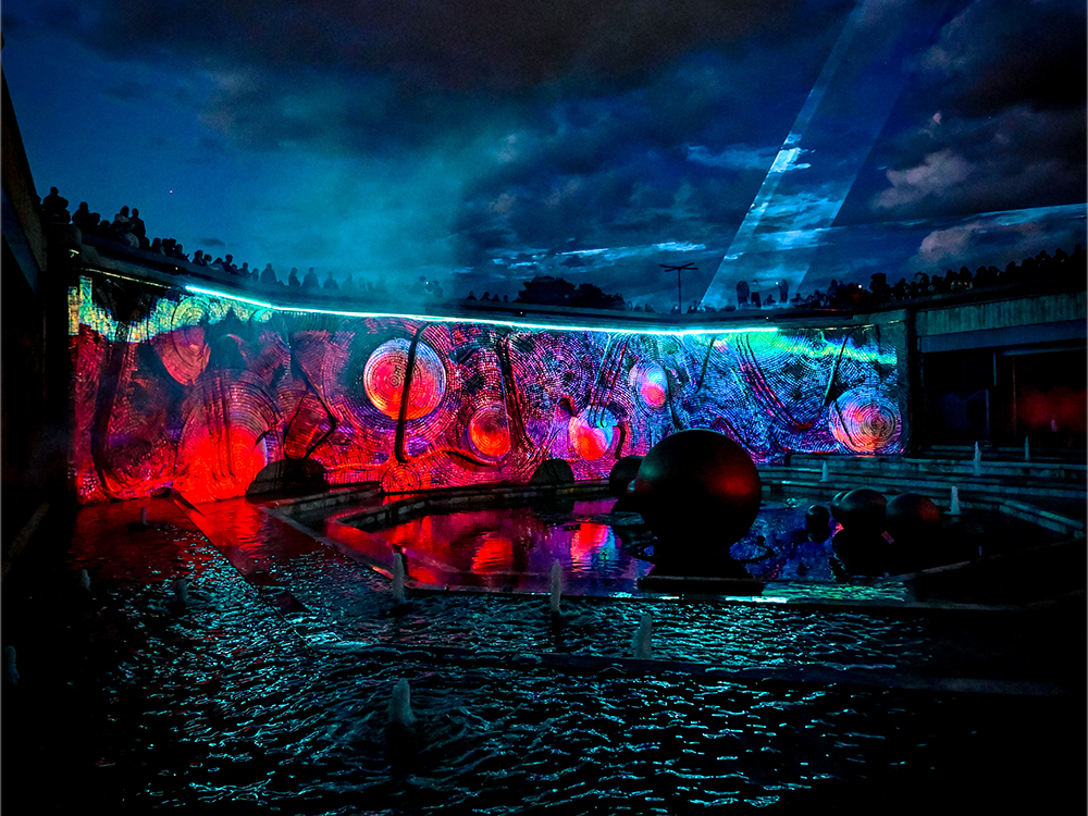 Warm-toned projection lighting a Sofia landmark at night